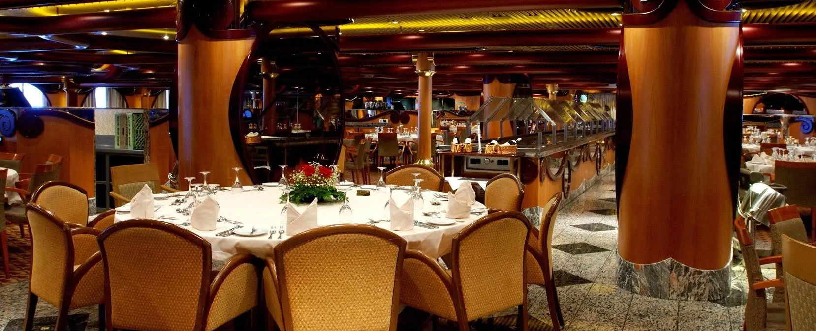 Elegant cruise ship restaurant dining room with set tables and buffet