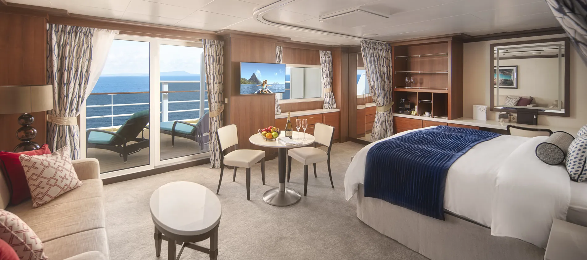 Luxurious cruise ship cabin with ocean view, balcony, and elegant decor
