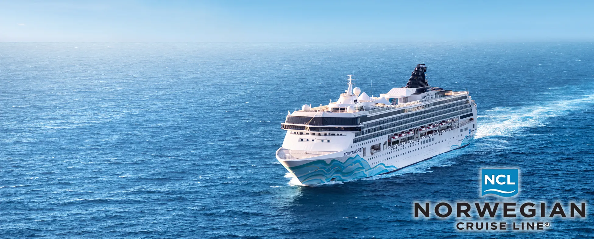 Norwegian Cruise Line ship sailing on blue ocean with white and blue design