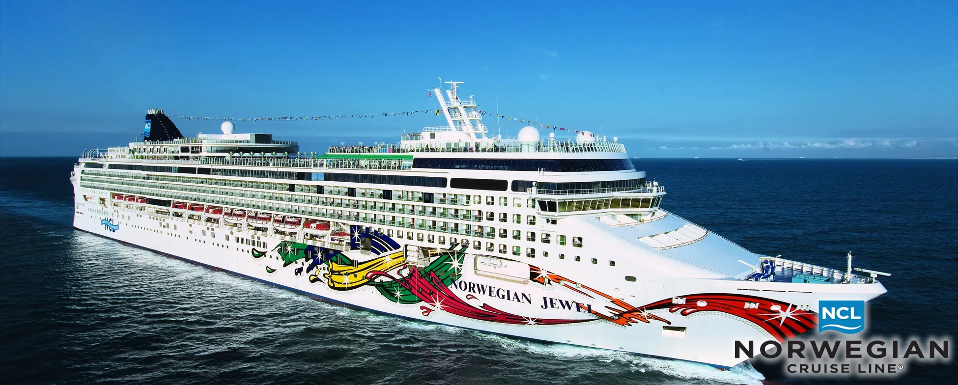 Norwegian Jewel cruise ship sailing on blue ocean with colorful design