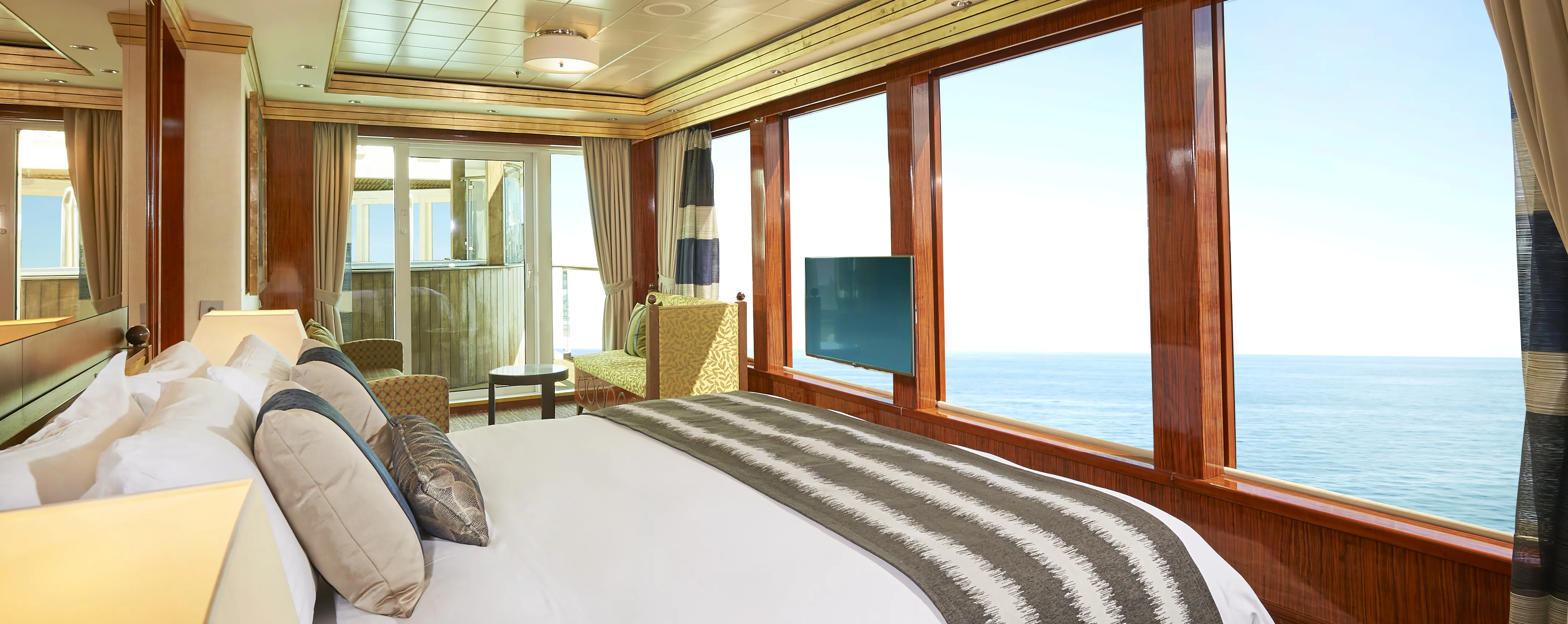 Luxury cruise ship cabin with ocean view and large windows