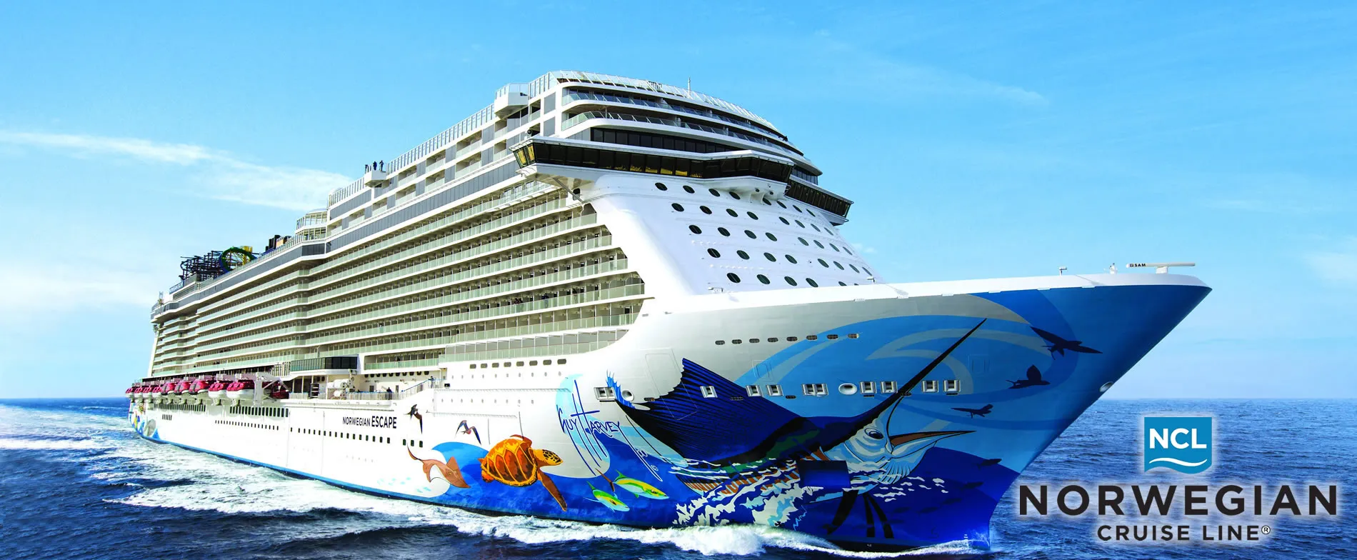 Large Norwegian Cruise Line ship with colorful ocean-themed exterior sailing blue waters