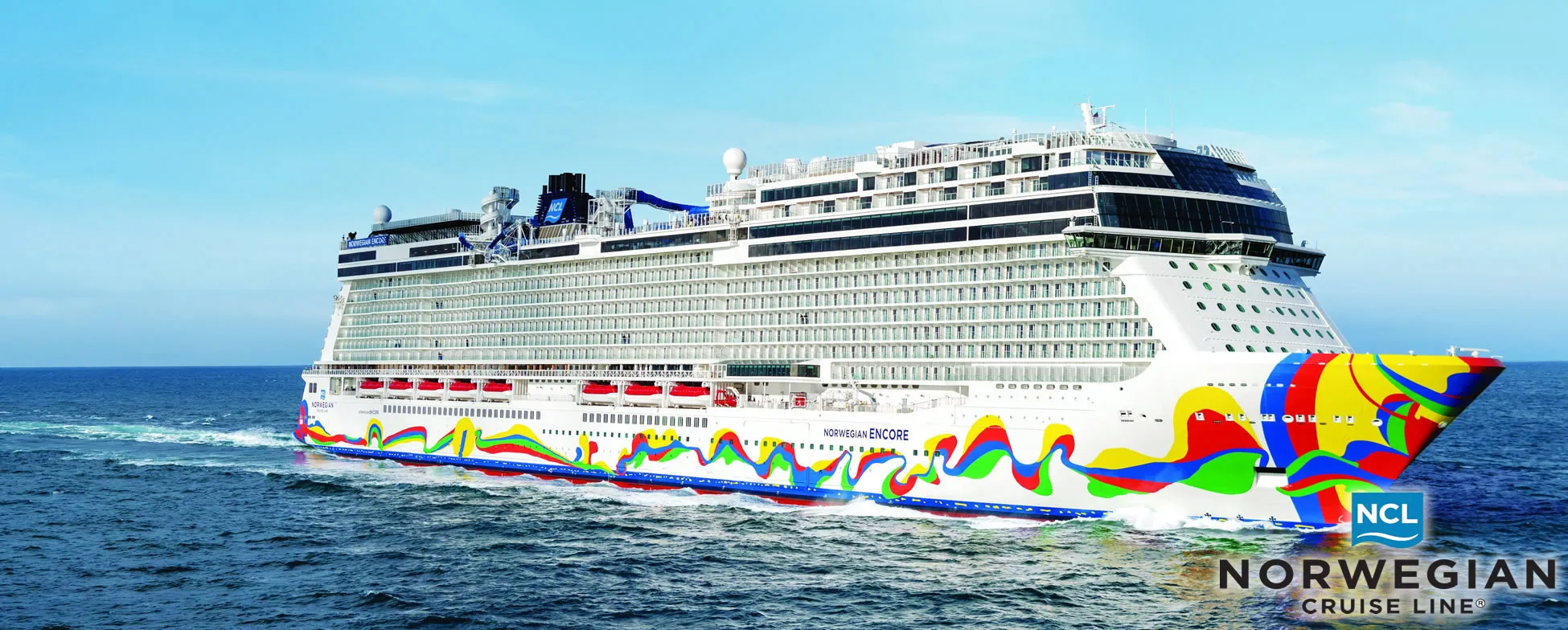 Colorful Norwegian Encore cruise ship sailing on blue ocean