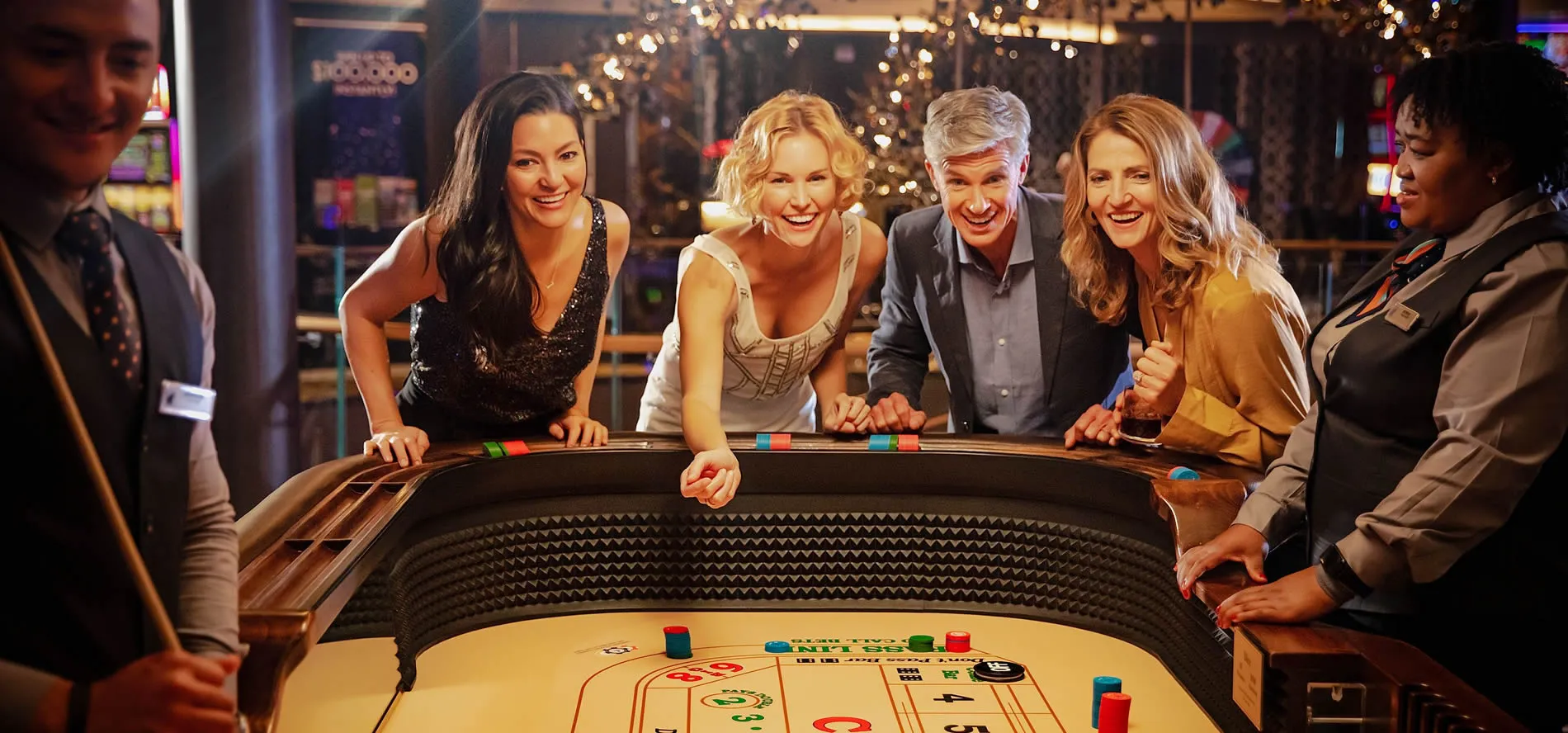 Friends playing board game at casino with excitement and colorful lights