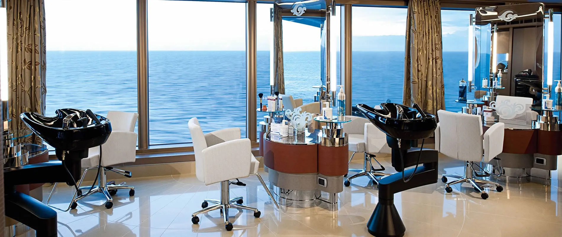 Luxury cruise ship salon with ocean view and hair washing stations