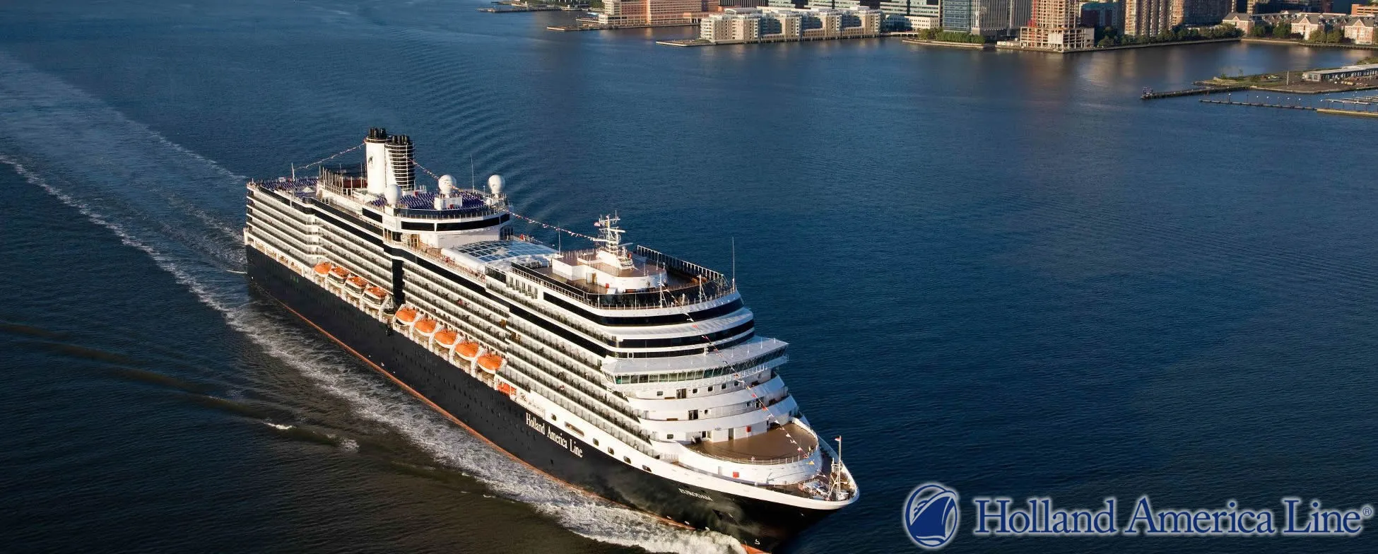 Holland America cruise ship sailing near city waterfront with urban skyline