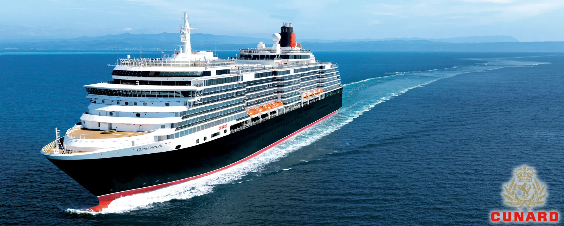 Cunard's Queen Victoria cruise ship sailing on blue ocean waters