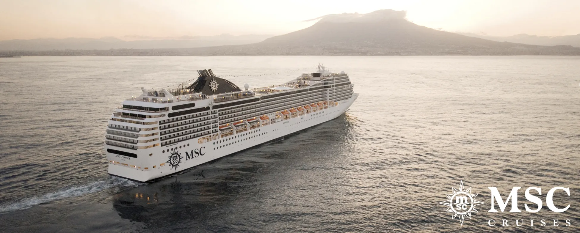MSC cruise ship sailing near mountain at sunset