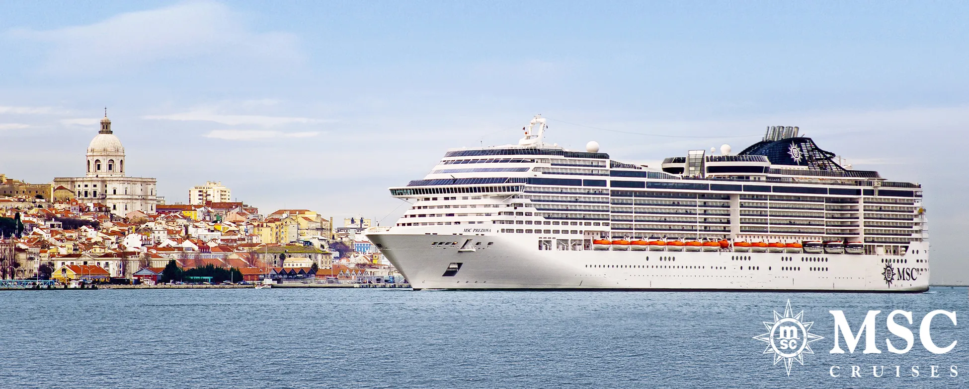 Large MSC cruise ship docked in Lisbon with historic city in background