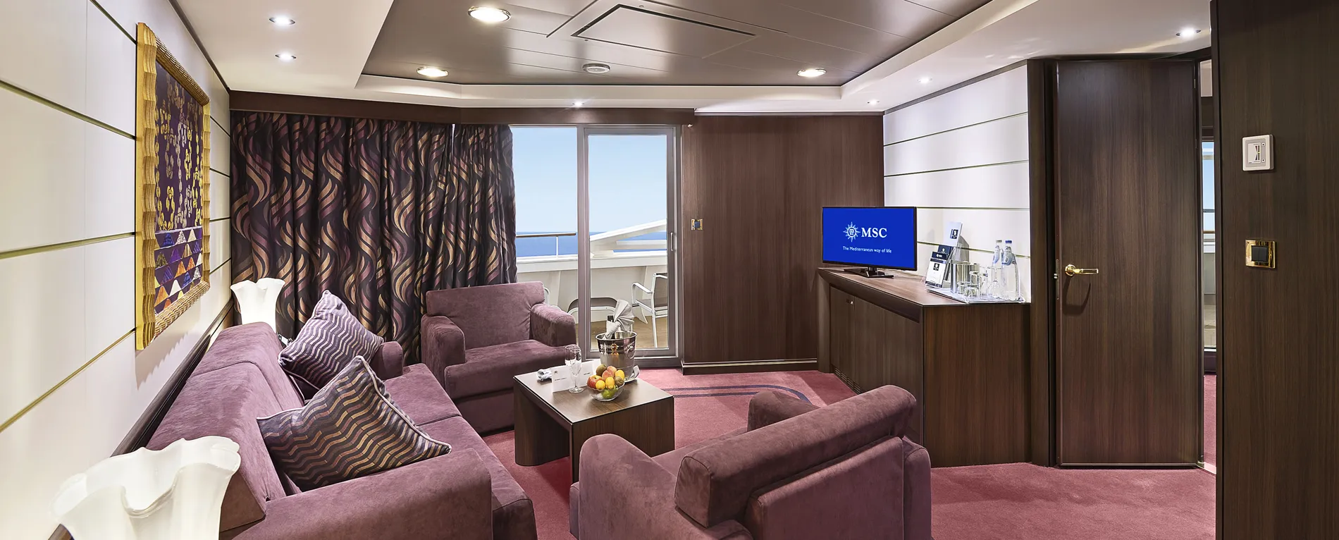 Luxurious MSC cruise ship cabin with plush seating and ocean view