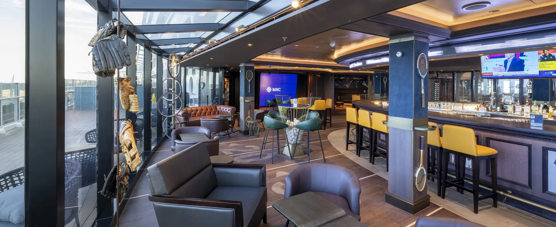 MSC cruise ship lounge with modern seating, bar, and nautical decor