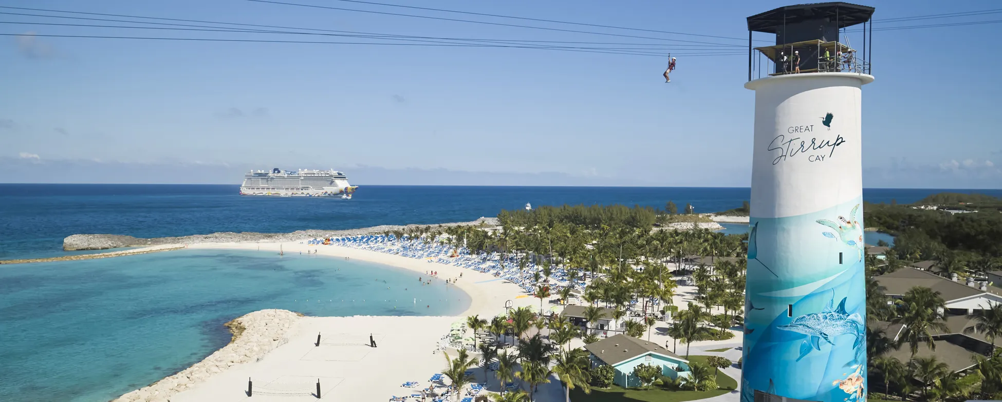 Great Stirrup Cay beach with cruise ship, zipline, and tropical landscape
