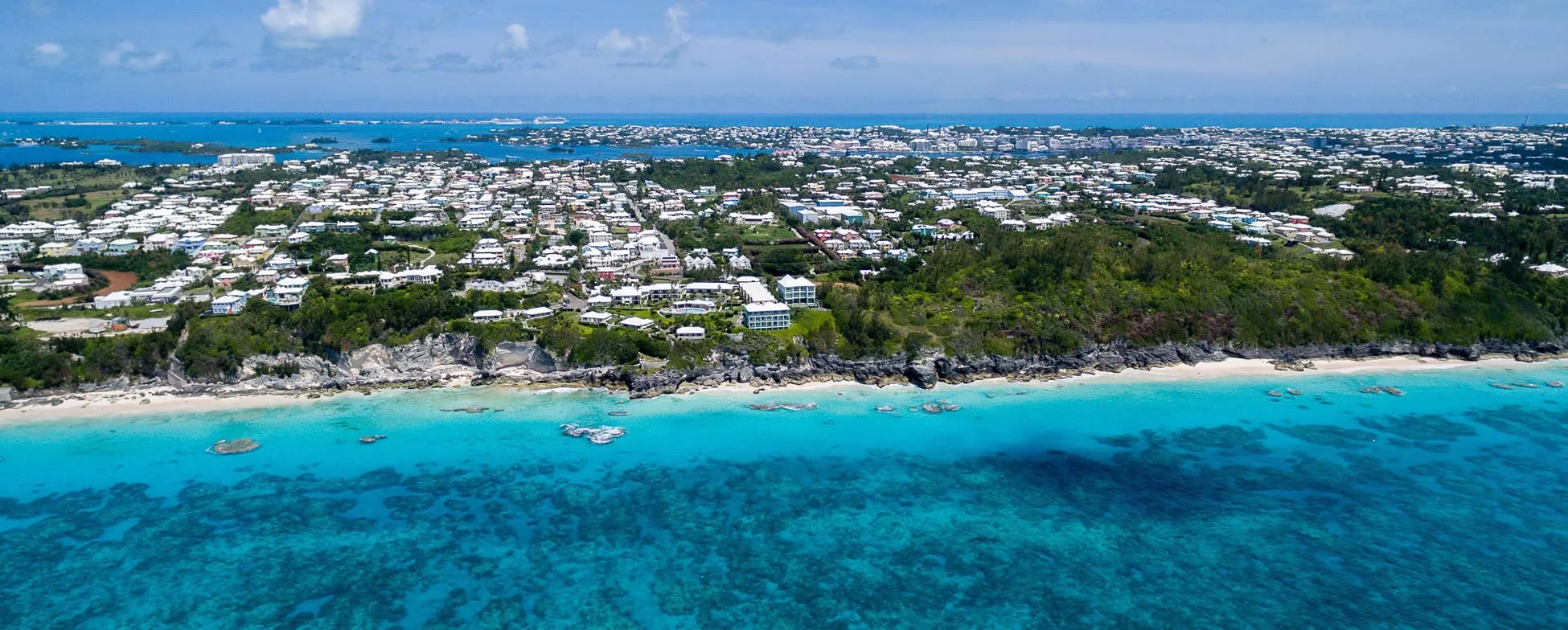 Aerial view of Bermuda, showing turquoise waters and white-roofed buildings