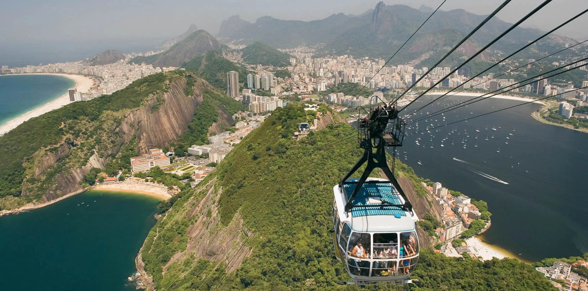 Cable car overlooking Rio de Janeiro's beaches, mountains, and city landscape
