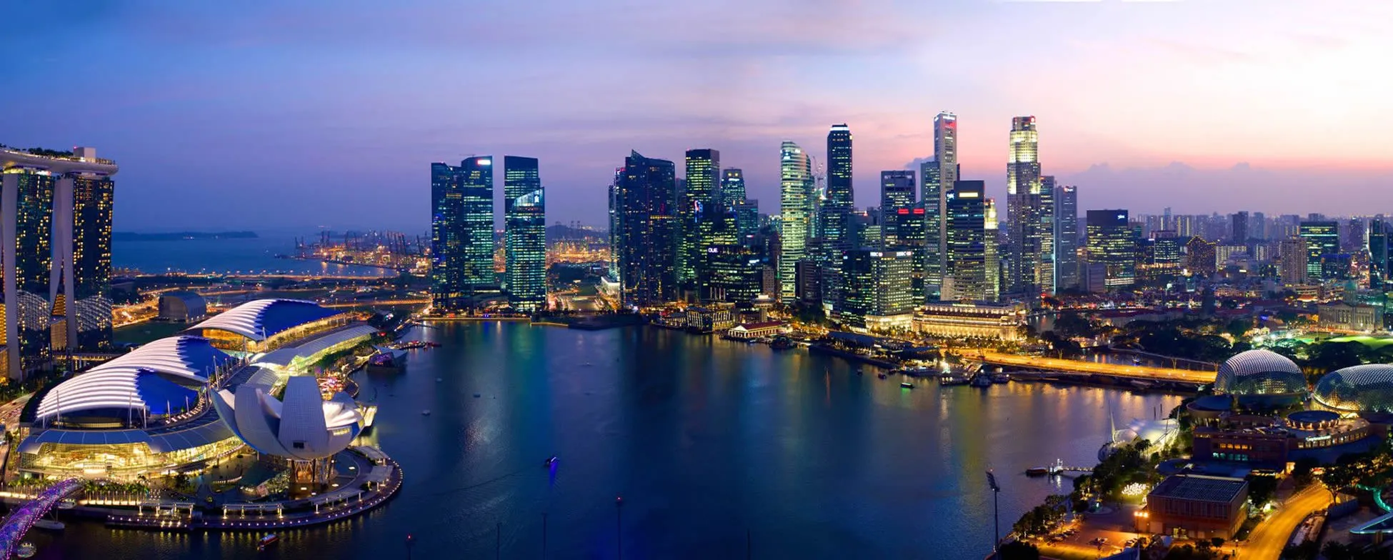 Singapore skyline at twilight with Marina Bay and illuminated skyscrapers