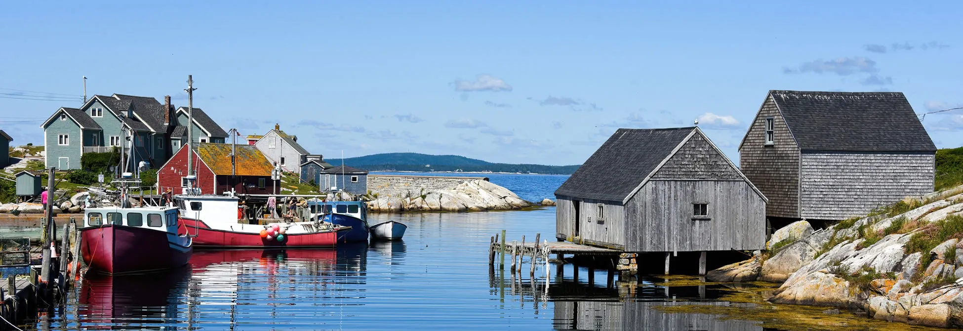 Colorful fishing boats docked in a picturesque Nova Scotia coastal village