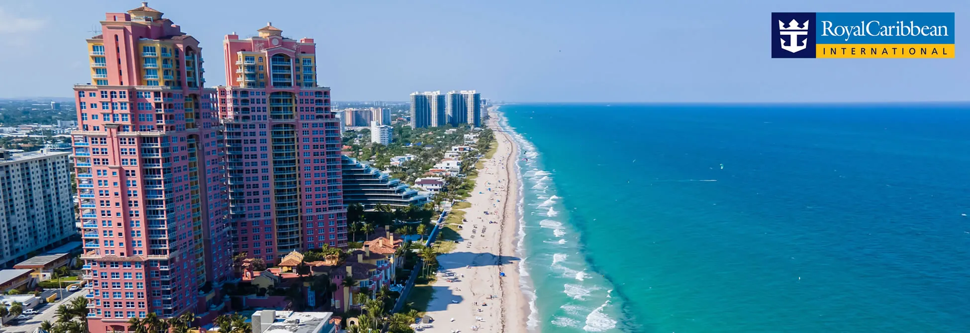 Colorful beachfront high-rise buildings along turquoise Miami coastline