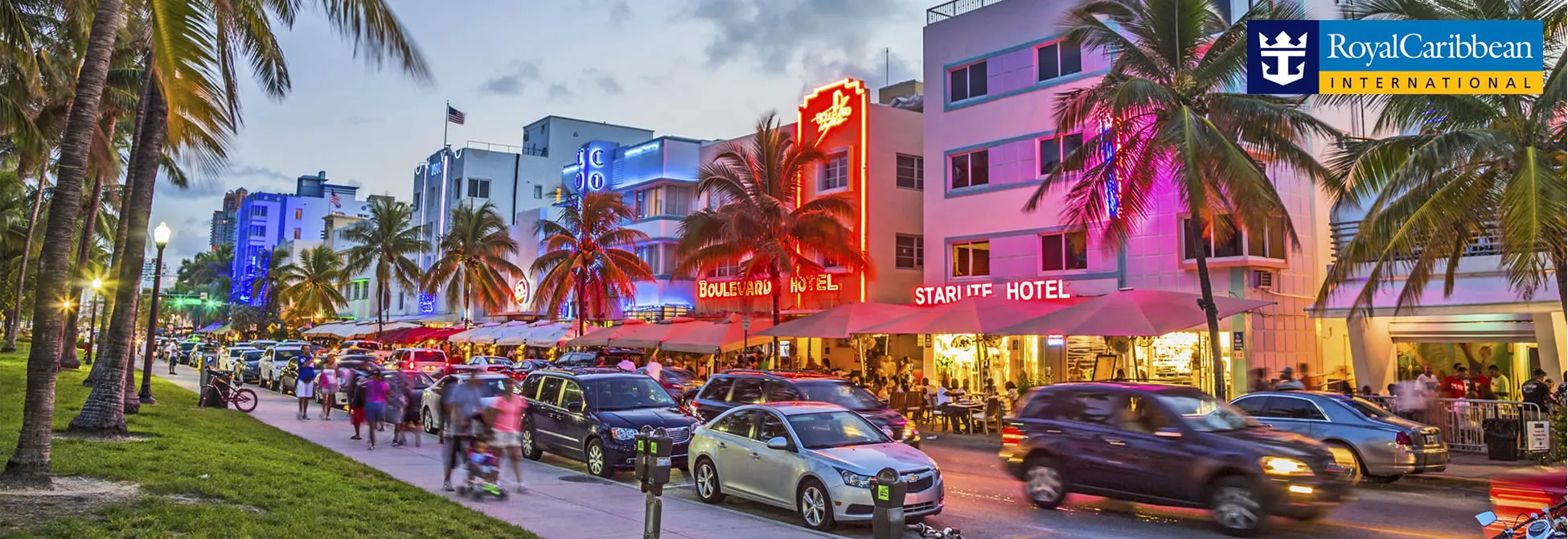 Vibrant Miami Beach street scene with neon hotels, palm trees, and busy traffic