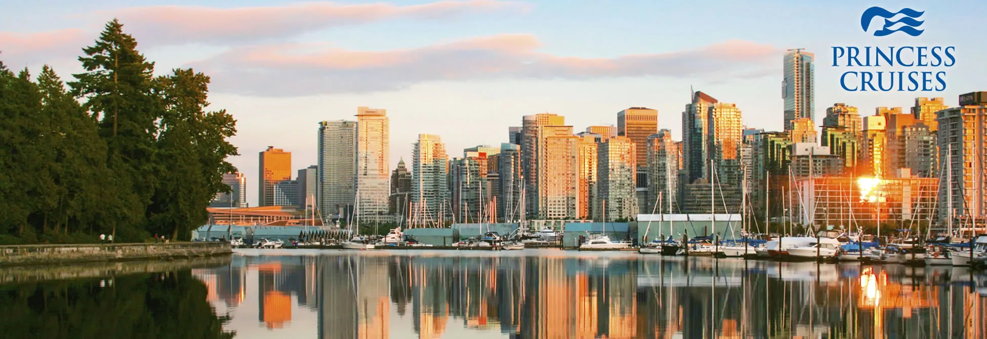 Vancouver skyline with marina, golden sunset reflecting on skyscrapers and water
