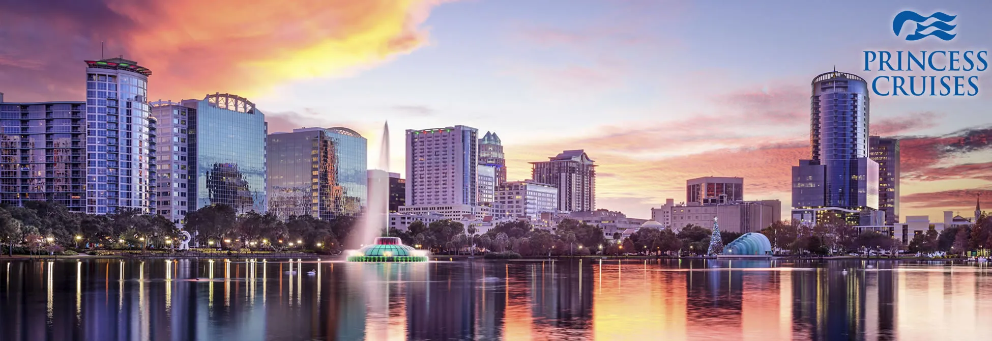 Orlando skyline with Lake Eola fountain at sunset, downtown buildings reflecting