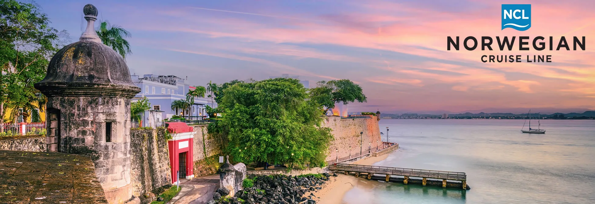 Old San Juan fortifications at sunset with Norwegian Cruise Line logo