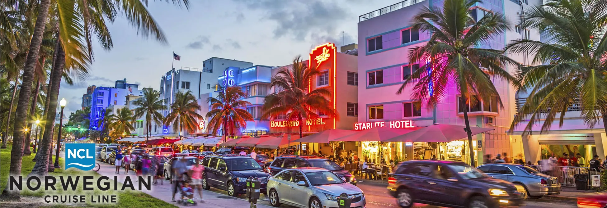 Miami Beach Ocean Drive at night with colorful Art Deco hotels and neon lights