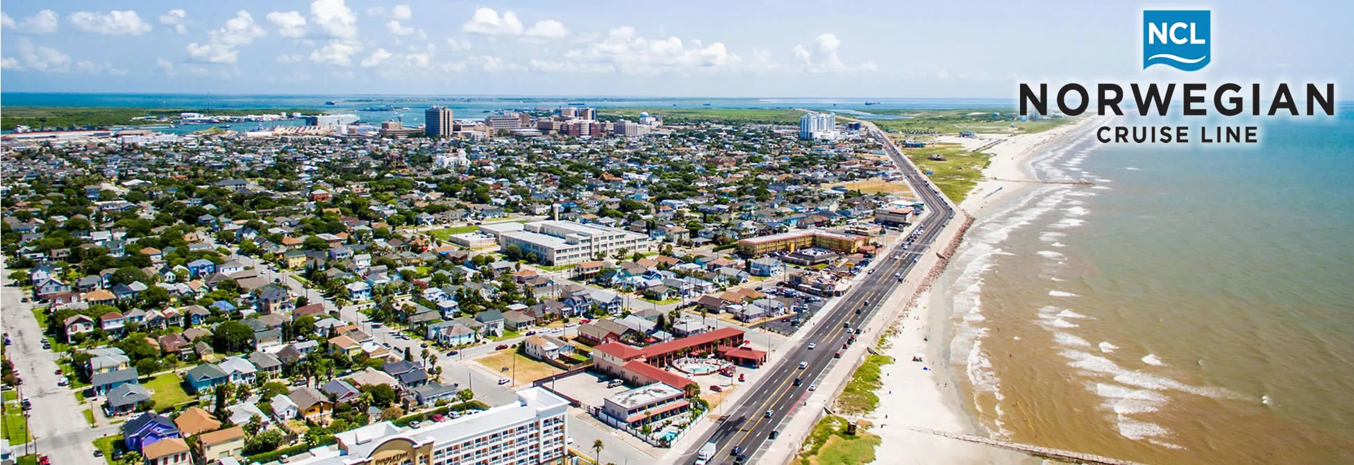 Aerial view of coastal city with beach, buildings, and Norwegian Cruise Line logo