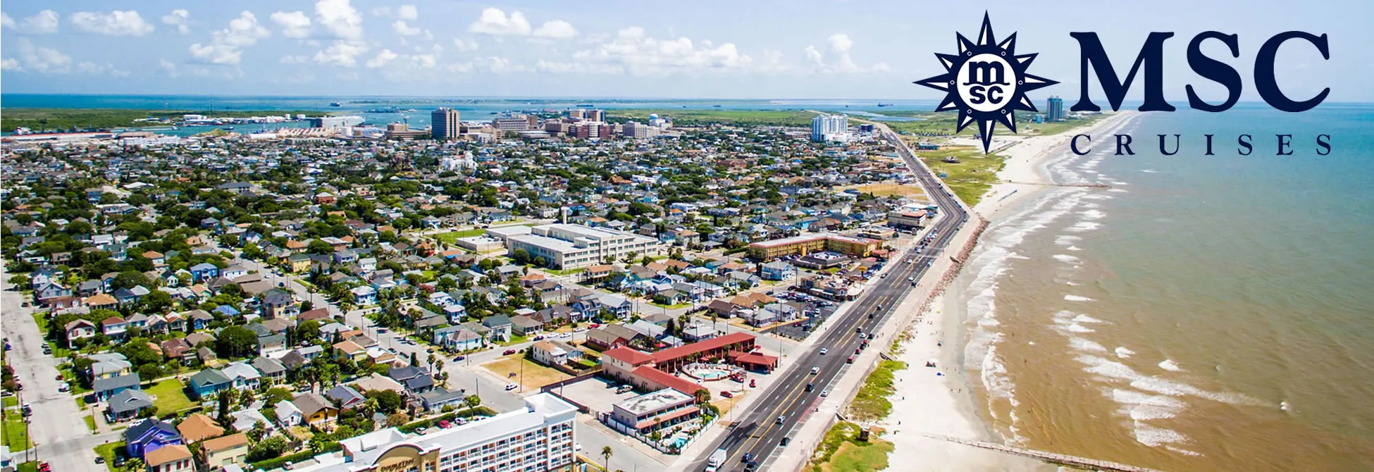 Aerial view of coastal city with MSC Cruises logo, beach, and dense urban landscape