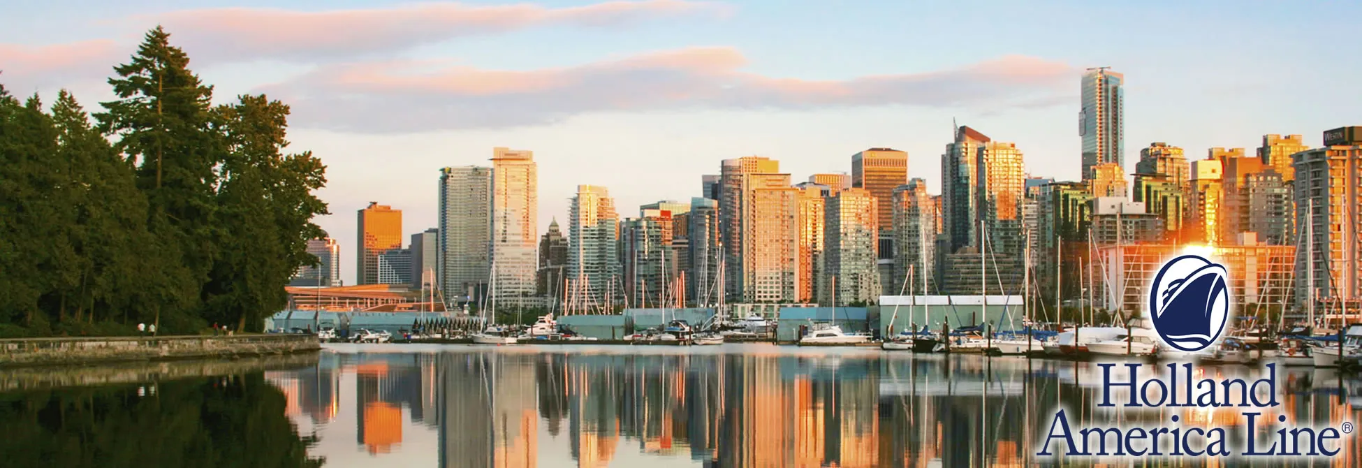 Vancouver skyline with marina, golden sunset reflecting on glass skyscrapers