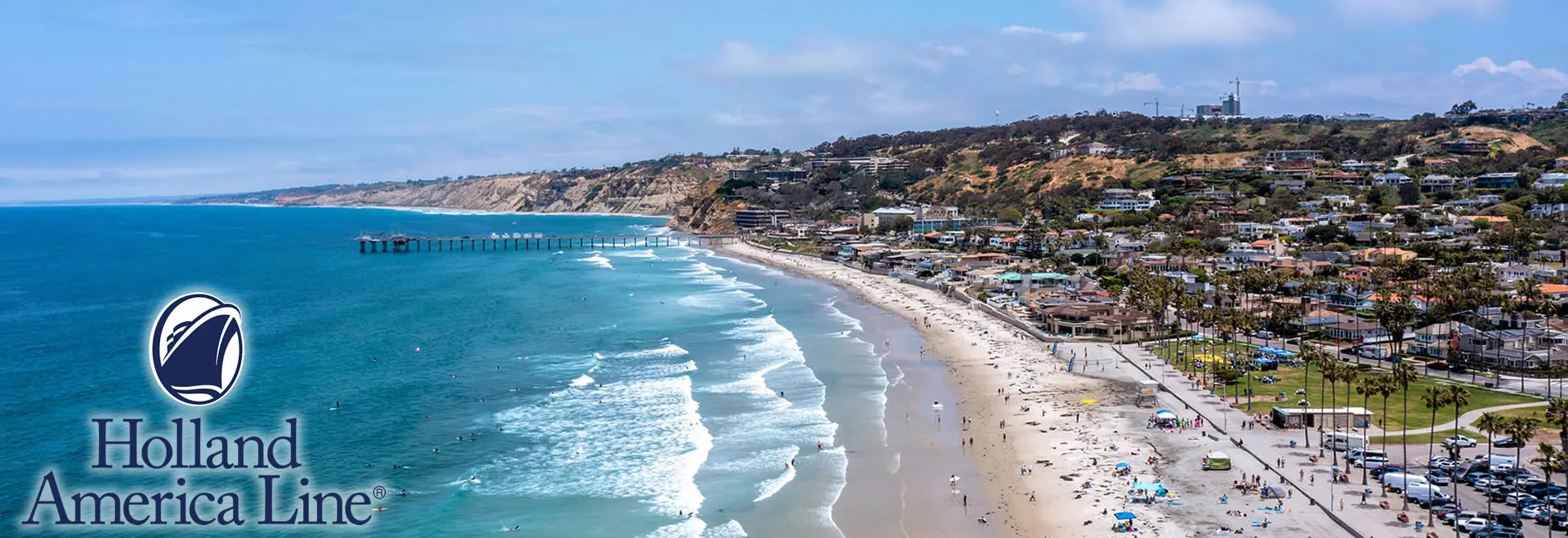 Aerial view of La Jolla Shores beach with pier and coastal buildings