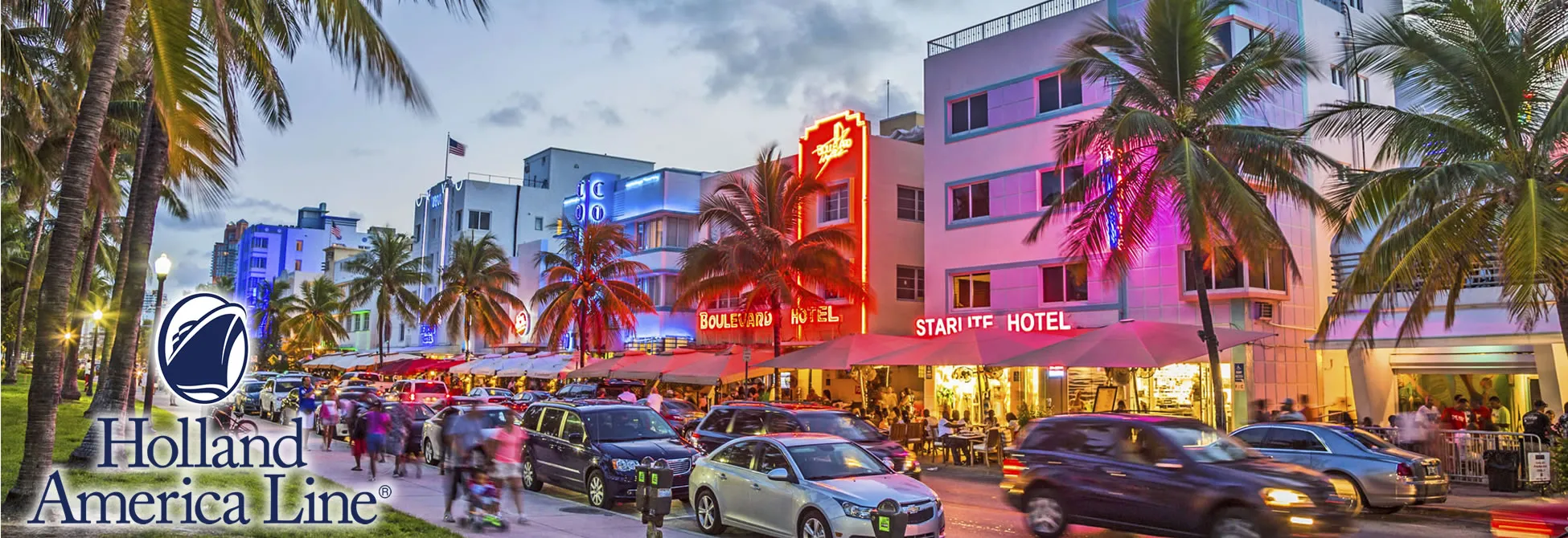 Miami Beach Ocean Drive at night with colorful hotels and palm trees