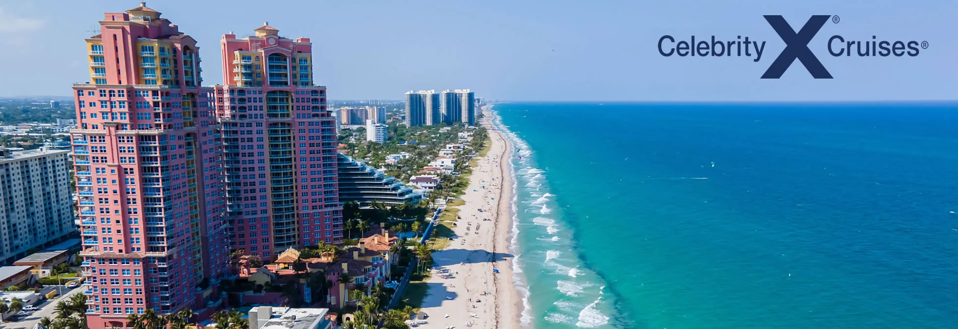 Colorful beachfront condos along turquoise waters of Florida coastline