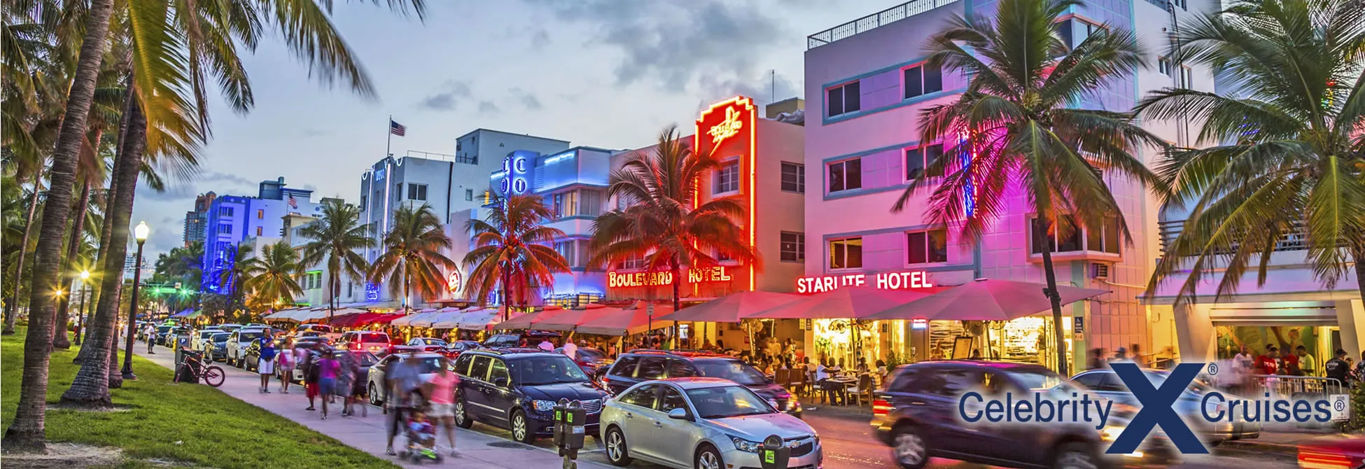 Vibrant Miami Beach street at night with neon hotels and palm trees