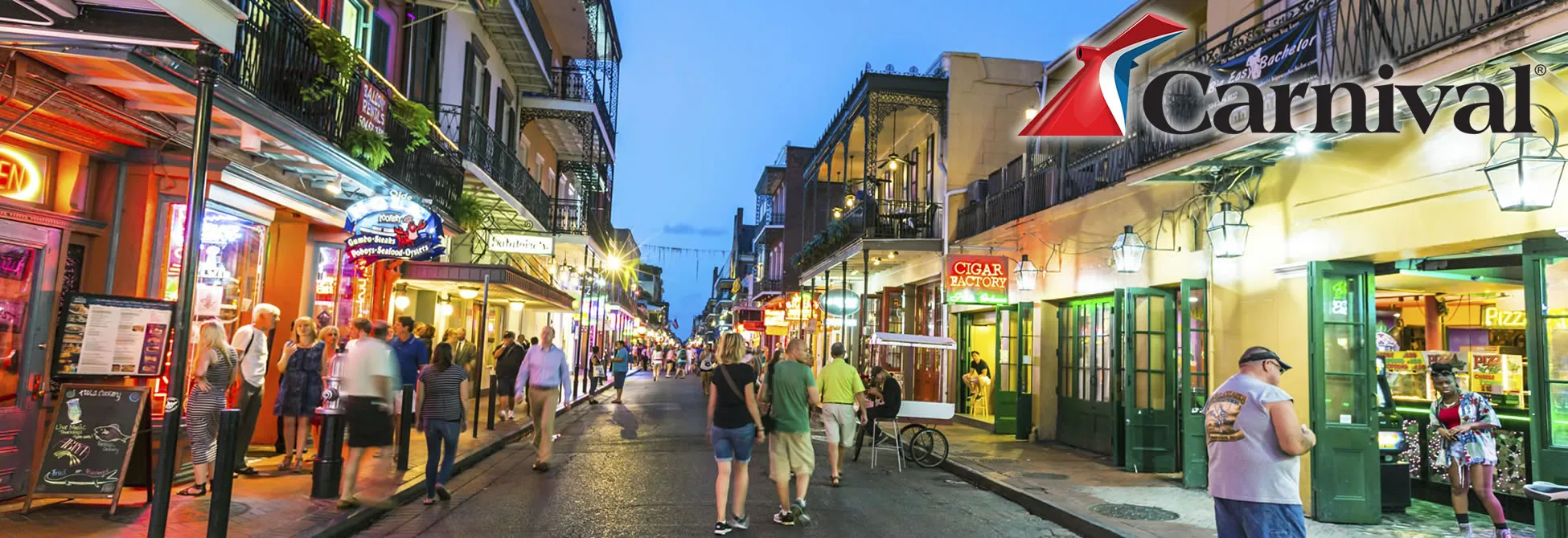 Bustling Bourbon Street in New Orleans at twilight with colorful buildings