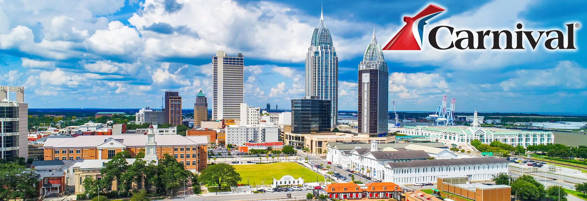 Mobile, Alabama skyline with Carnival Cruise logo on bright sunny day