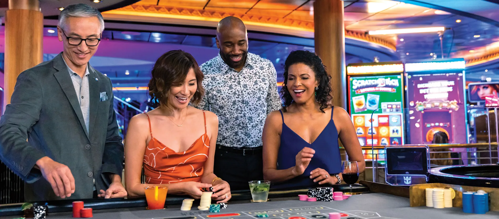 Friends enjoying casino night with colorful chips and drinks