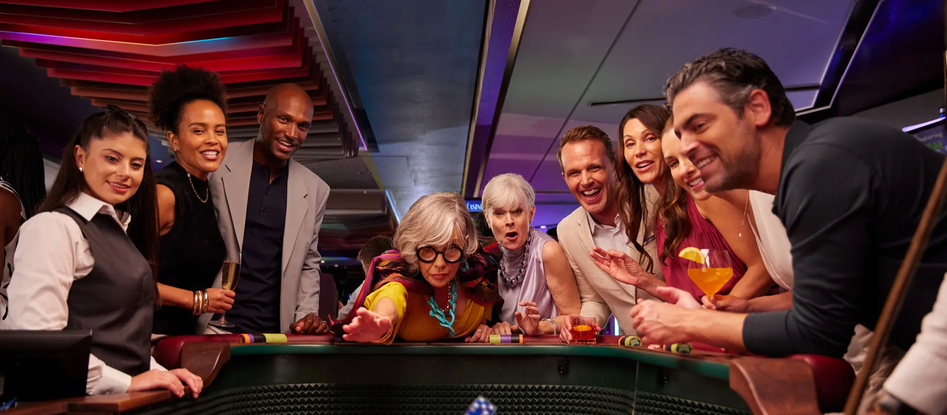 Diverse group of people playing and enjoying roulette at a casino