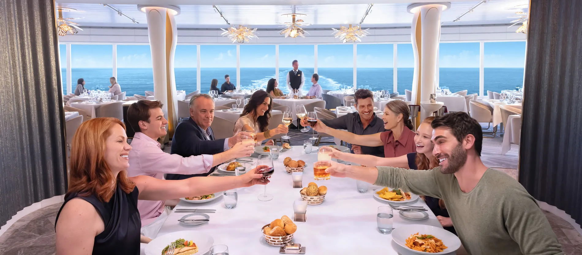 Group dining and toasting at an elegant cruise ship restaurant with ocean view