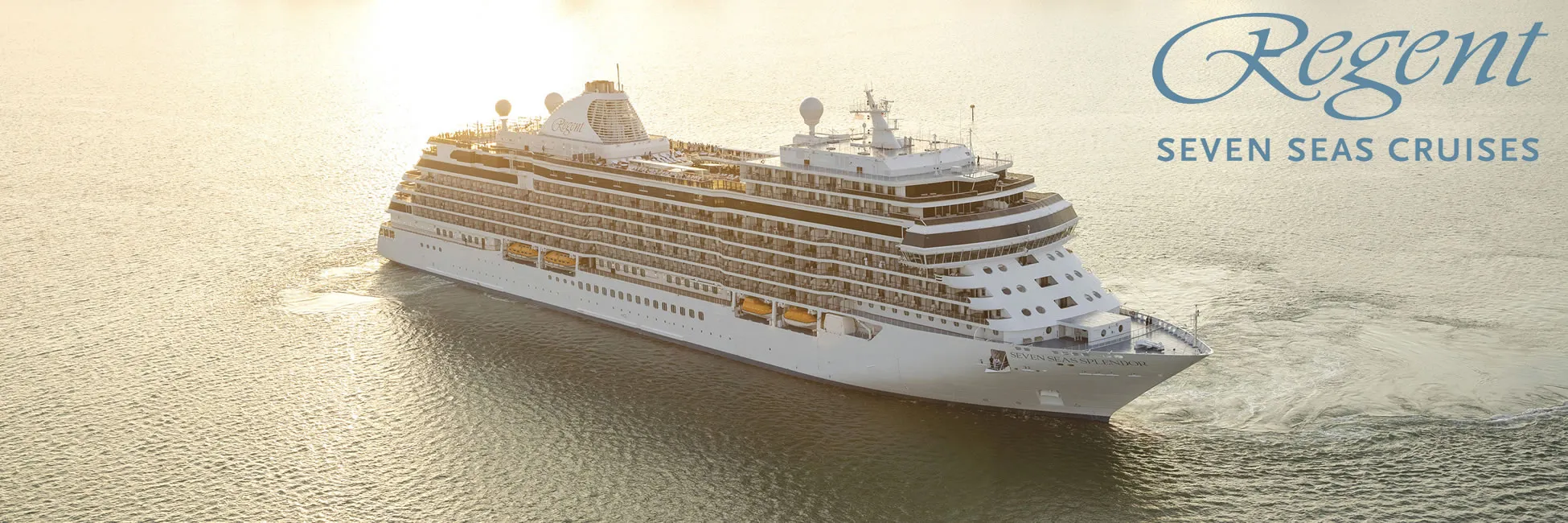 Regent Seven Seas cruise ship sailing on calm waters at sunset