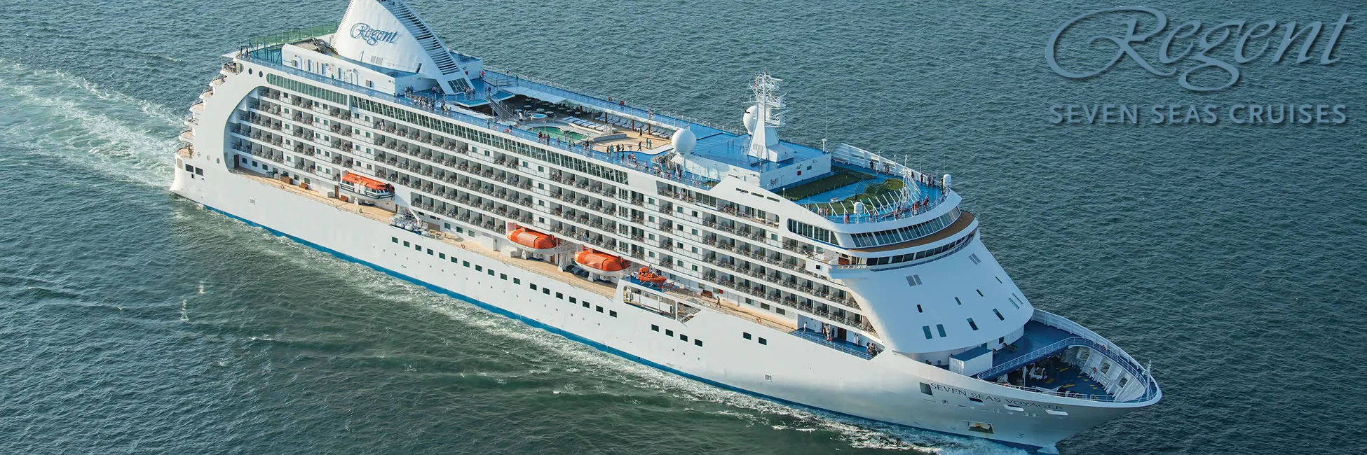 Regent Seven Seas luxury cruise ship sailing on blue ocean waters