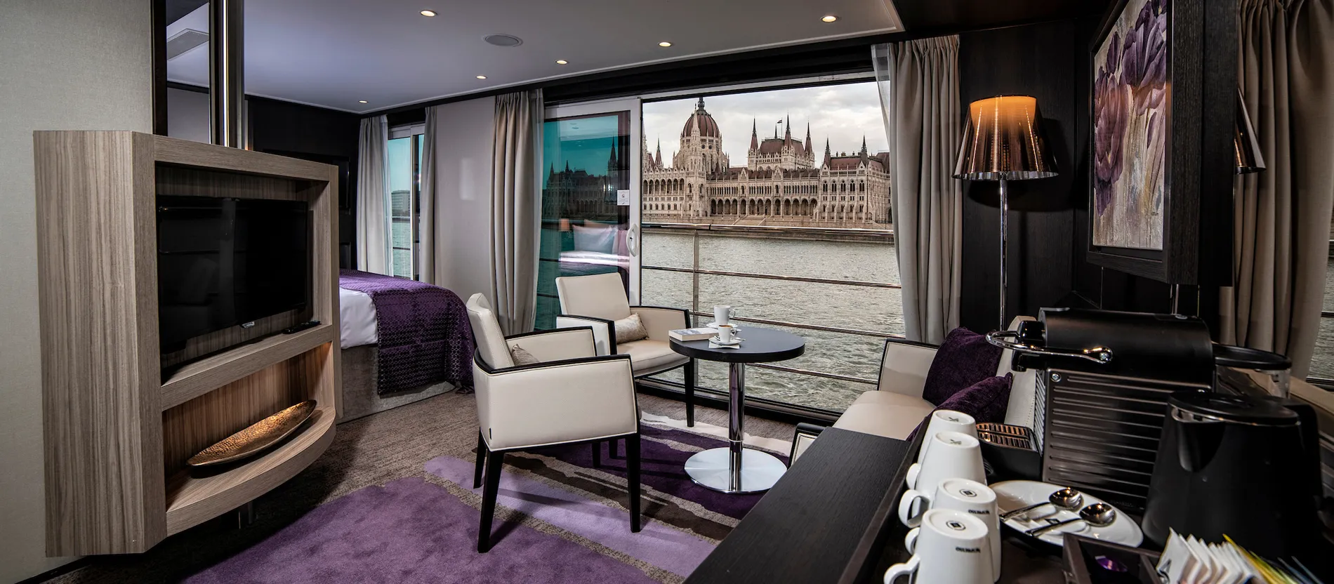 Luxurious hotel room with view of Budapest Parliament building from window