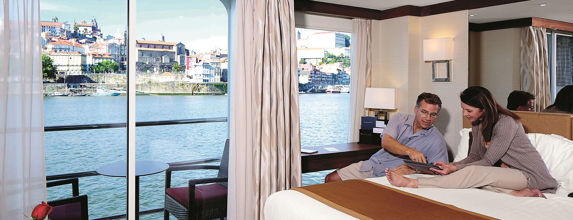 Cruise cabin with waterfront view of Porto, Portugal cityscape