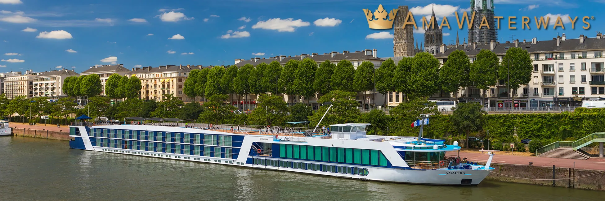 AmaWaterways river cruise ship docked in European city with historic buildings