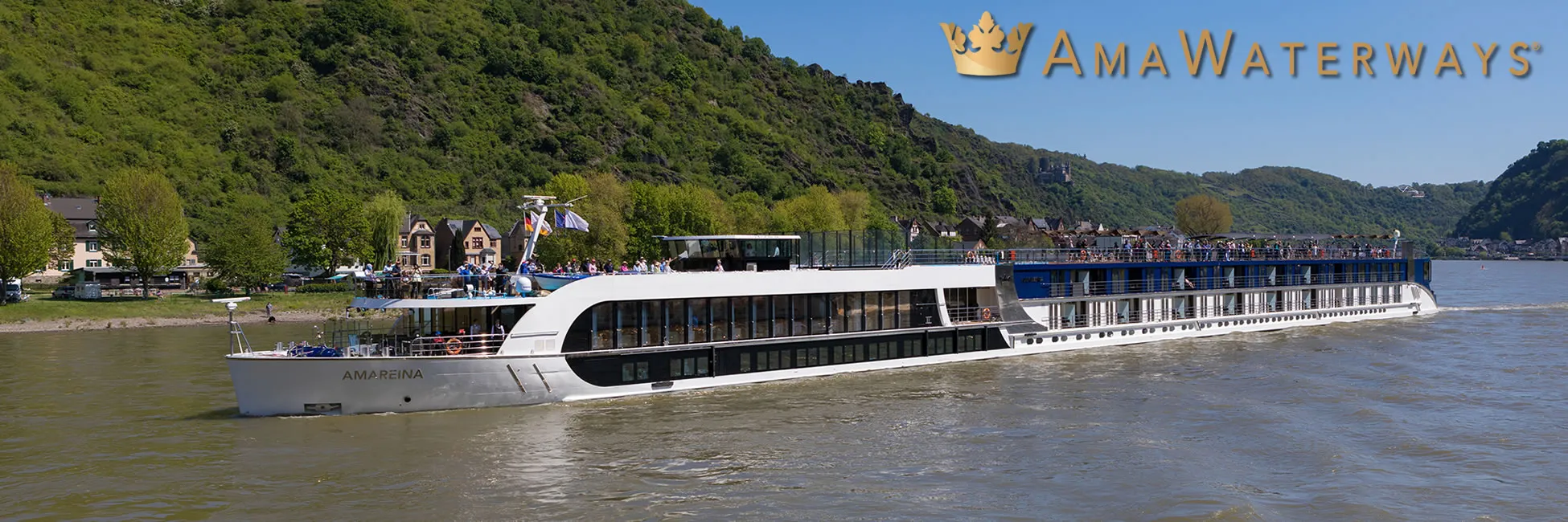 AmaWaterways cruise ship sailing along scenic river with green hills