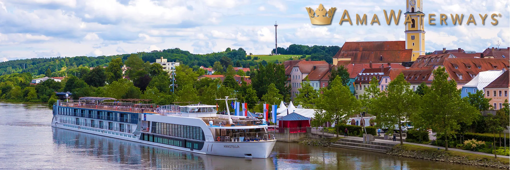 AmaWaterways river cruise ship docked in European town with historic buildings