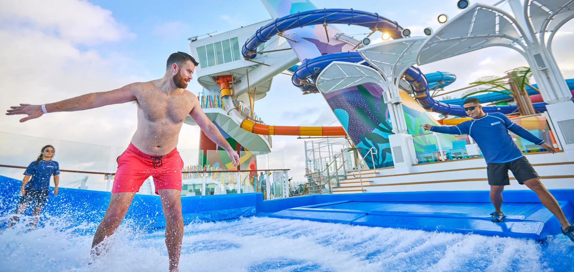 Cruise ship water park with people surfing on artificial wave ride
