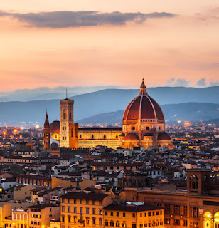 Florence skyline with illuminated Duomo at sunset, Tuscany, Italy