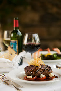 Gourmet steak dish with red wine, elegant restaurant plating