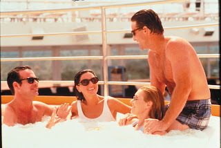 People relaxing together in a hot tub on a sunny day