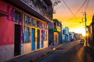 Colorful colonial street at sunset with vibrant buildings and warm light